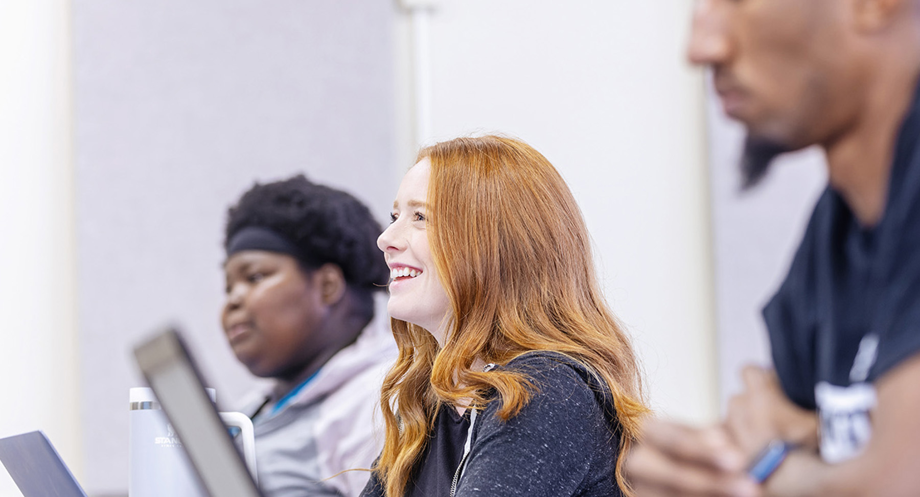 Three students in computer lab