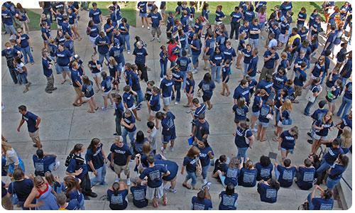Group of Students Outside in Blue Line Shirts