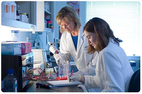 Student and Professor Working in Lab