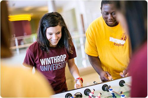 Students playing foosball