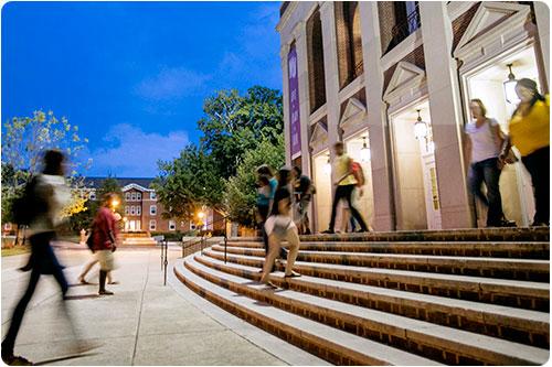 Students on the steps of Byrnes at night