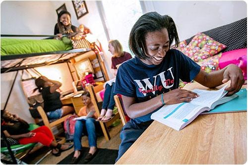 Students studying in a dorm room
