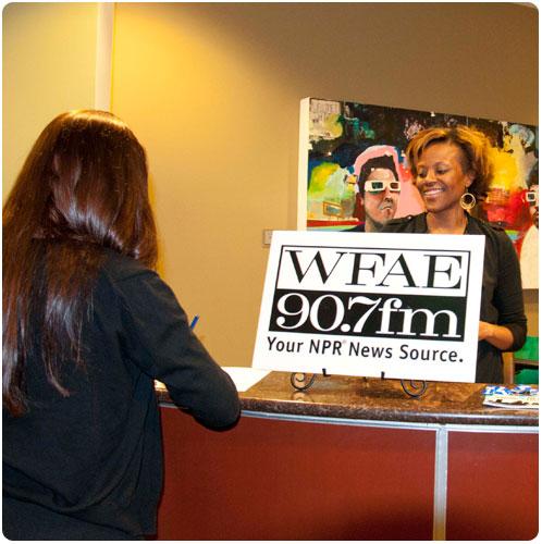 Students and members of the public arrive at the WFAE Public Conversatio