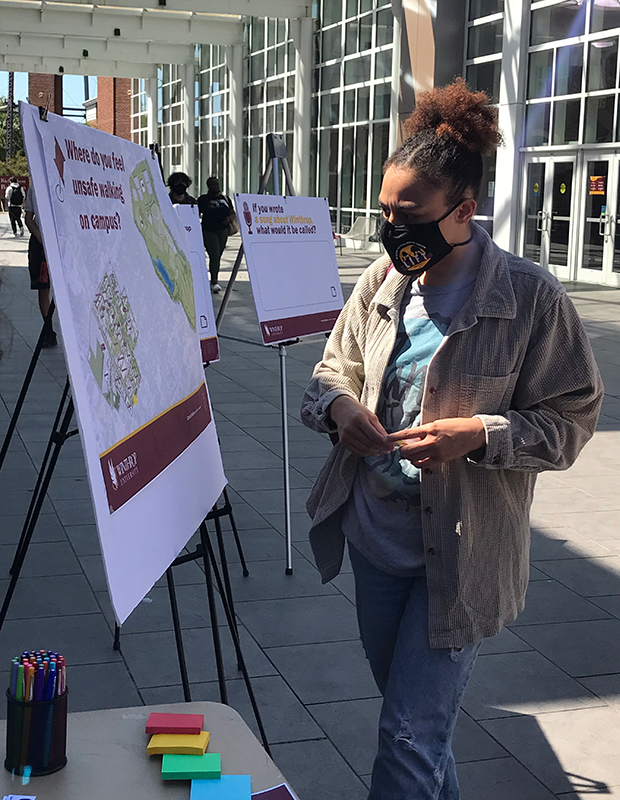 Student interacting with a poster