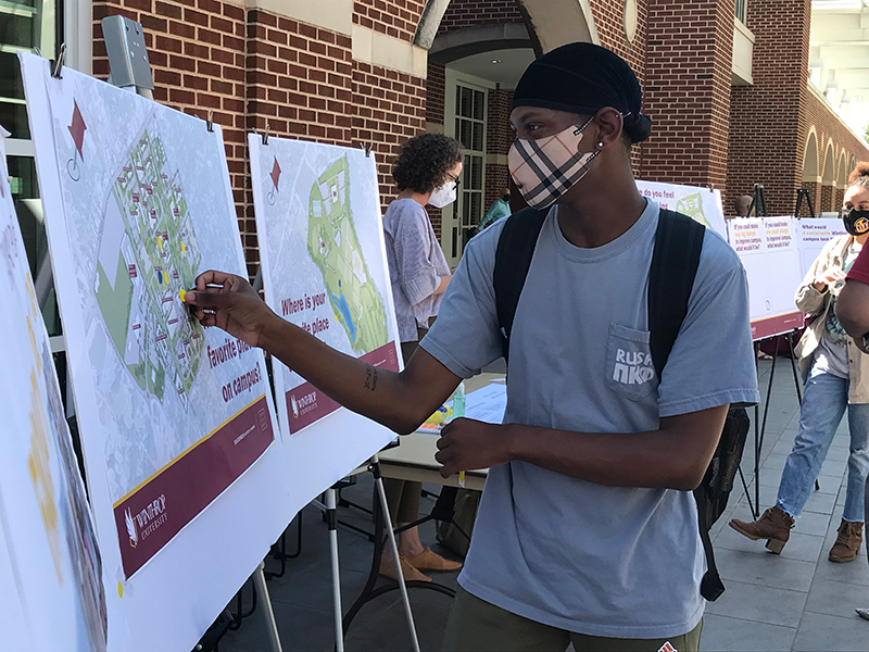 Student interacting with a poster
