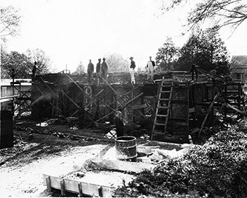 workers reconstructing the little chapel