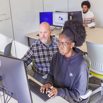 Faculty member teaching student