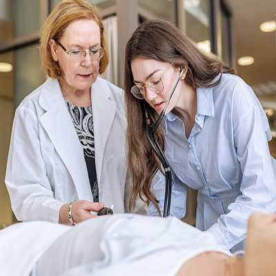 Faculty member teaching student