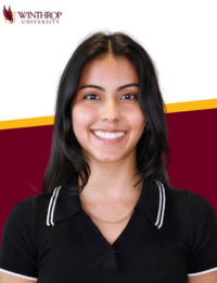 Woman smiling against a Winthrop background