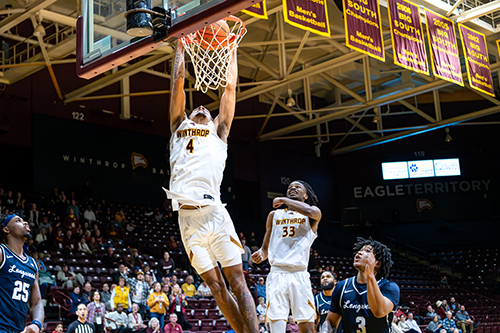 Men's Basketball Player Kelton Talford dunking the ball