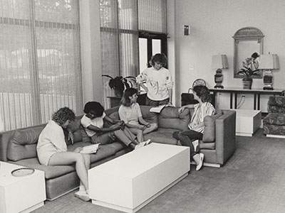 Women sitting on couches