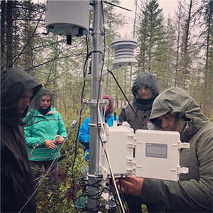 Collecting weather station data in the subarctic.