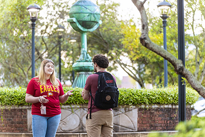 two students talking on campus