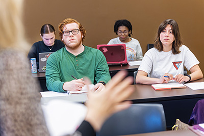 students listening to a lecture in a classroom