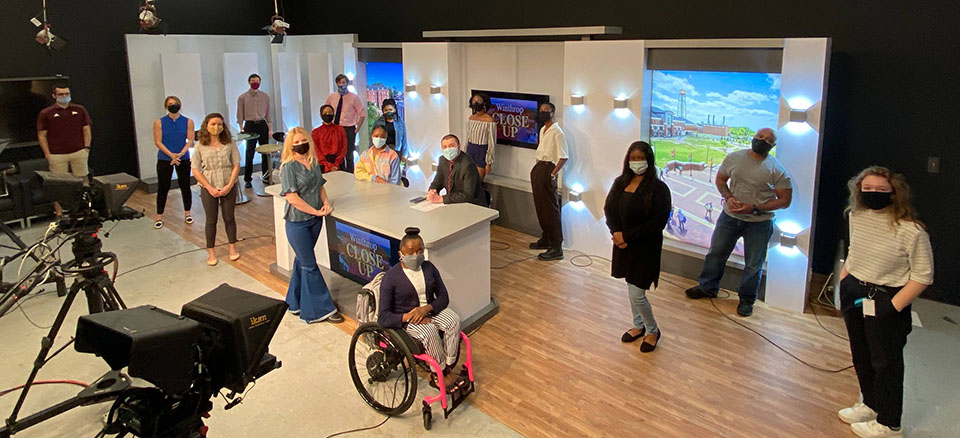 A group of students in a TV studio.