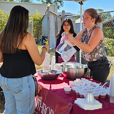 Students hand out food at Harvest Fest