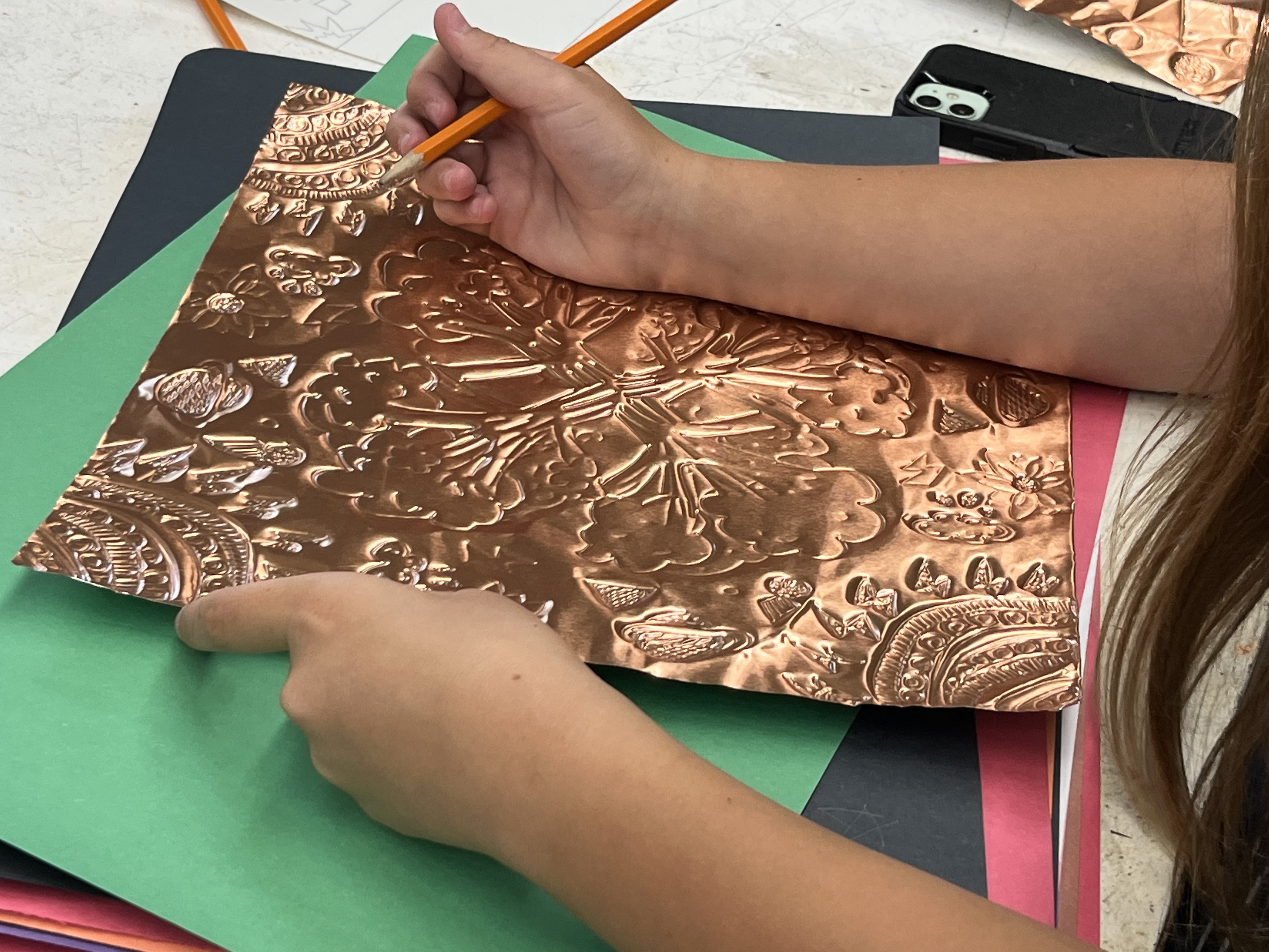 student working on art project