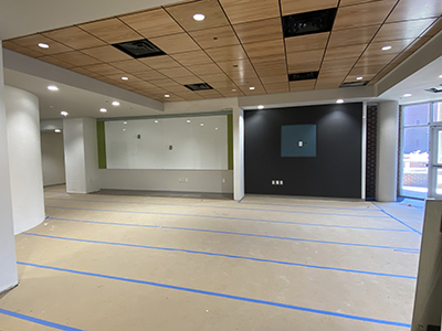 New wooden tiles and spotlights highlighting fresh paint and clean floor
