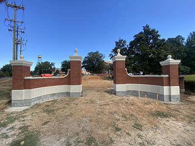New brick and concrete entry ways with a blue sky in the background