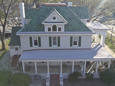 Upward angle of Stewart House's new green slate roof