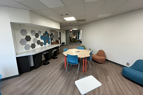 Empty Space Classroom With Wall Art And Round Table