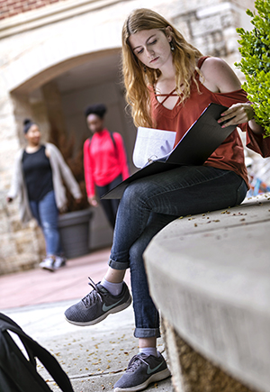 a student studying outside of Courtyard