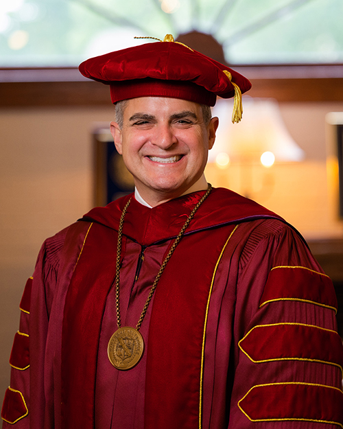 Winthrop President Edward A. Serna in full academic regalia at the December 2022 Commencement
                        ceremony