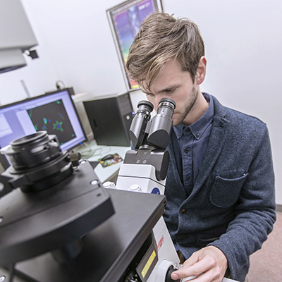 Student using a microscope