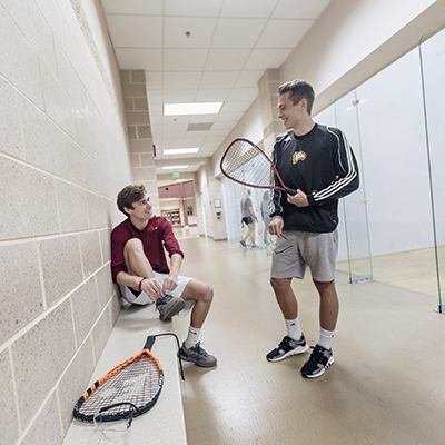 Students outside of the racquetball courts