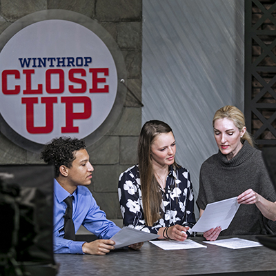 Students preparing to record a newscast