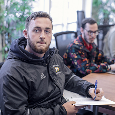Students taking notes in class