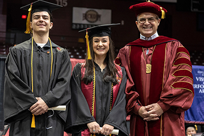 Atley Livingston, center, at her December 2022 commencement
