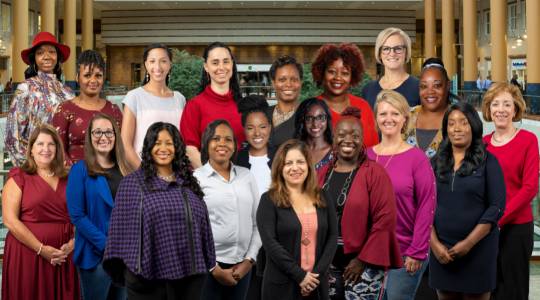 ANSWER Scholars - Johanna Enireb is front row center in the black jacket; Monkia Wells is in the back row, second from the left.