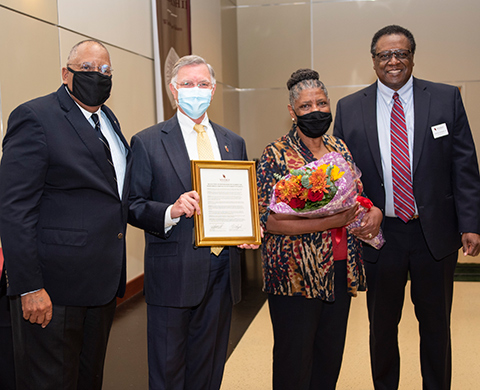 Board chair Glenn McCall, from left, Interim President George Hynd, Dot Barber and Board member Tim Hopkins in 2020 during her golden anniversary.