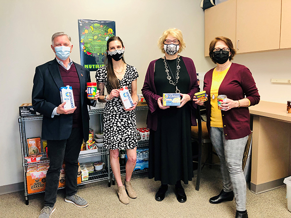 From left: Interim President Hynd, Nutrition staff member Alexa Allen, Nutrition Chair Wanda Koszewski, and First Lady Alison Hynd