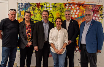 Academic leadership surprised Claudia O'Steen with the award. Fine Arts Chair Mark Hamilton, from left, Dean Karen Oremus, Provost Sebastian van Delden, O'Steen and Assistant Provost Tim Drueke. 