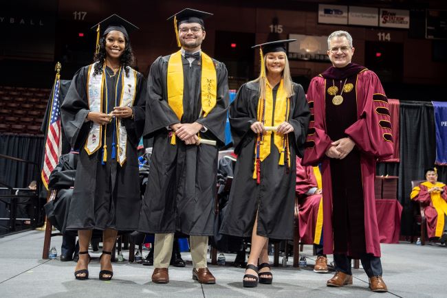 From left: Jessia Smith; Cody Cook; Millie Bridwell; and President Edward Serna
