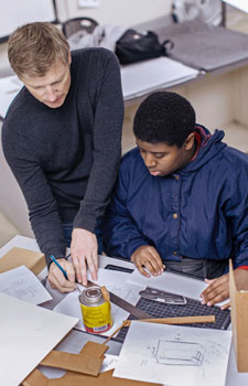 Design Professor Gerry Derksen advises a student.