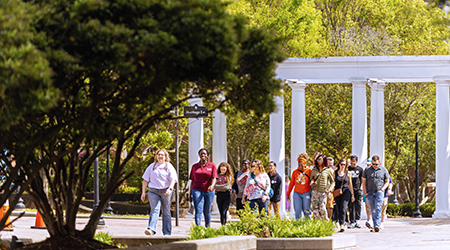 a tour group walking through campus