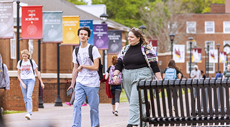 two students walking together on scholars walk