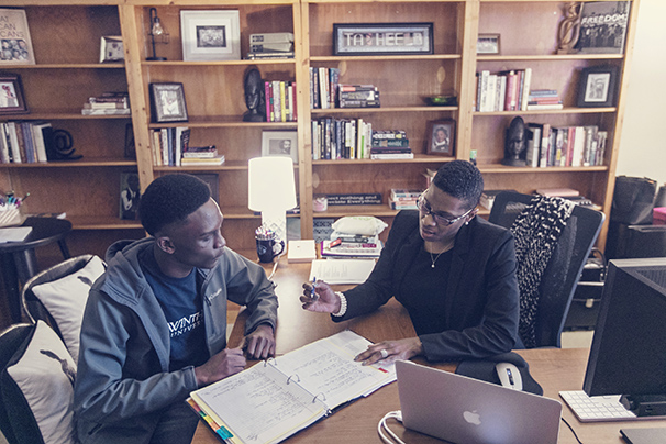 a professor having a one-on-one tutoring session with a student in her office