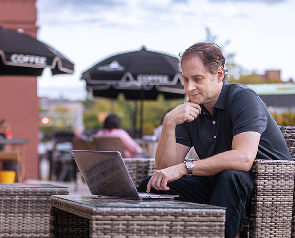 a graduate student using a laptop