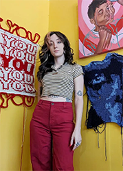 Devann Gardner posing with her art