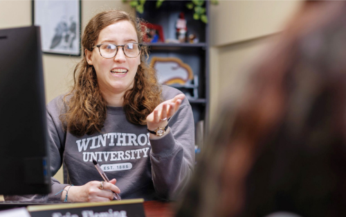 financial aid counseling talking with a student in her office