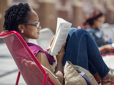 a student reading outside