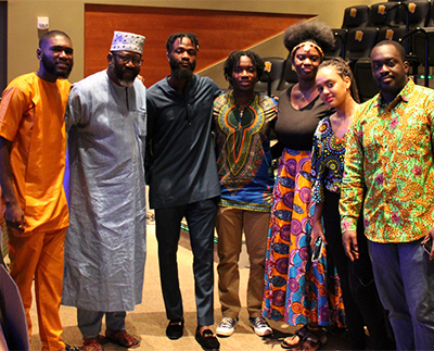 a group of people in traditional African clothes during an event on campus