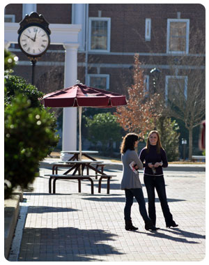 two women at clock