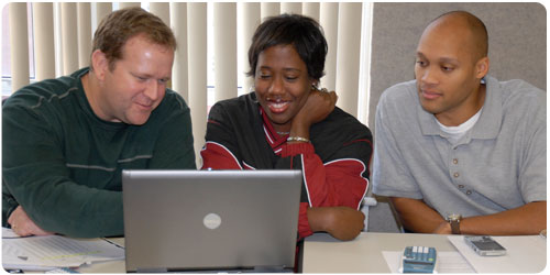 three adults at laptop 2
